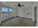 Bright main bedroom with ceiling fan and multiple windows at 12892 E 99Th Pl, Commerce City, CO 80022