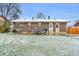 View of the house from the backyard with a stone patio and furniture at 9360 Lowell Blvd, Westminster, CO 80031