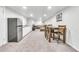 Finished basement space with kitchenette, dining area, and cozy lounge area at 9360 Lowell Blvd, Westminster, CO 80031