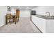 Finished basement with dining area, kitchenette featuring white cabinets and gray countertops at 9360 Lowell Blvd, Westminster, CO 80031