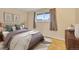 Serene bedroom features a comfortable bed and a bright window view at 9360 Lowell Blvd, Westminster, CO 80031