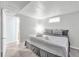 Bedroom with neutral decor, and a doorway to the bathroom and closet at 9360 Lowell Blvd, Westminster, CO 80031