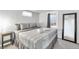 Bedroom featuring neutral decor, side table, mirror and comfortable carpet at 9360 Lowell Blvd, Westminster, CO 80031