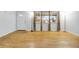 Sunlit living room with beautiful hardwood floors and large windows at 9360 Lowell Blvd, Westminster, CO 80031