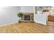 Cozy living room with a stone fireplace and an open layout to the kitchen at 9360 Lowell Blvd, Westminster, CO 80031