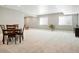 Spacious finished basement features neutral paint, recessed lighting, and updated windows at 13034 Bridge View Ln, Parker, CO 80134