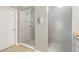 Modern bathroom featuring two glass enclosed showers with tiled walls and flooring, and neutral decor at 13034 Bridge View Ln, Parker, CO 80134