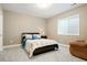 Cozy bedroom with plush carpeting, large window and neutral paint provides a relaxing retreat at 13034 Bridge View Ln, Parker, CO 80134