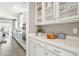 Bright kitchen features white cabinets, stainless steel appliances, and an open layout at 13034 Bridge View Ln, Parker, CO 80134
