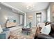 Bright living room featuring neutral walls, wood floors, and a leather sofa at 13034 Bridge View Ln, Parker, CO 80134