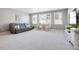 Spacious living room with a comfortable sofa and natural light from large windows at 13034 Bridge View Ln, Parker, CO 80134