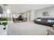 Open loft area with seating and stairs at 13034 Bridge View Ln, Parker, CO 80134