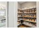 Well-organized pantry with ample shelving and clear containers for storage at 13034 Bridge View Ln, Parker, CO 80134