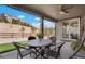 Relaxing covered patio with ceiling fan offers shade for enjoying the surrounding landscape at 13034 Bridge View Ln, Parker, CO 80134