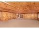 Spacious basement featuring wood paneling on the walls and ceiling and neutral carpeting at 85 Revett Dr # 66, Breckenridge, CO 80424
