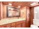 Modern bathroom featuring wood walls, granite counters, and a sink at 85 Revett Dr # 66, Breckenridge, CO 80424