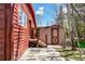 Side exterior view showing a wood-sided house and a shed at 85 Revett Dr # 66, Breckenridge, CO 80424