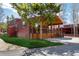 Charming cabin with a covered porch surrounded by lush greenery and mature trees, perfect for relaxation at 85 Revett Dr # 66, Breckenridge, CO 80424