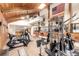 Well-equipped gym features exercise equipment and high, exposed-beam ceilings, as well as a wall-mounted television at 85 Revett Dr # 66, Breckenridge, CO 80424