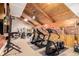 Well-equipped workout facility features wood ceiling, modern equipment, and natural light for a bright and inviting atmosphere at 85 Revett Dr # 66, Breckenridge, CO 80424