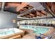 Indoor pool area featuring a hot tub and seating at 85 Revett Dr # 66, Breckenridge, CO 80424