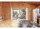 Kitchen island with granite countertop, a stainless steel stove, and window views of the outside at 85 Revett Dr # 66, Breckenridge, CO 80424