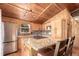 Well-lit kitchen featuring an island with granite countertops and modern stainless steel appliances at 85 Revett Dr # 66, Breckenridge, CO 80424