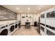 Clean, well-maintained laundry room featuring rows of modern washing machines and dryers for resident convenience at 85 Revett Dr # 66, Breckenridge, CO 80424