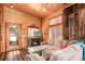 Relaxing living room showcasing a stone fireplace, comfortable seating, and natural light at 85 Revett Dr # 66, Breckenridge, CO 80424