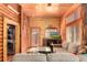 Comfortable living area featuring a cozy fireplace, modern appliances, and warm wood paneling at 85 Revett Dr # 66, Breckenridge, CO 80424