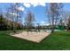 Playground with swings and slide nestled in grassy area under trees at 85 Revett Dr # 66, Breckenridge, CO 80424