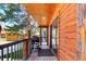 Cozy porch area with wooden deck, complete with a grill, offering a perfect outdoor cooking space at 85 Revett Dr # 66, Breckenridge, CO 80424