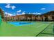 Vibrant tennis courts surrounded by lush greenery and blue skies at 85 Revett Dr # 66, Breckenridge, CO 80424