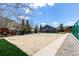 Sandy volleyball court with a nearby deck and building at 85 Revett Dr # 66, Breckenridge, CO 80424