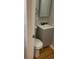 Small bathroom with toilet, sink, and vanity at 9927 E 7Th Ave, Aurora, CO 80010
