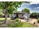 Spacious backyard with patio, play equipment, and lush greenery at 1215 S Ivanhoe Way, Denver, CO 80224
