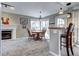 Cozy dining area with a round table, a fireplace, and a kitchen bar top at 1215 S Ivanhoe Way, Denver, CO 80224