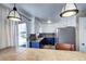 Well-lit kitchen with granite countertops, stainless steel appliances, and access to outdoor living at 1215 S Ivanhoe Way, Denver, CO 80224