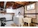 Basement laundry room with washer and dryer and a utility sink at 1215 S Ivanhoe Way, Denver, CO 80224