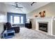 Comfortable living room with a bay window, fireplace, and ample seating at 1215 S Ivanhoe Way, Denver, CO 80224