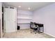 Office space with shelving and carpeted floors for a quiet work environment at 1215 S Ivanhoe Way, Denver, CO 80224