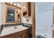Bathroom featuring modern vanity with solid surface countertop and tiled walls at 695 Manhattan Dr # 109, Boulder, CO 80303