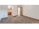 Bedroom with en-suite bathroom, neutral paint, and new carpet flooring at 695 Manhattan Dr # 109, Boulder, CO 80303