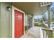 Exterior shot of unit with red door and a large slider to the patio at 695 Manhattan Dr # 109, Boulder, CO 80303