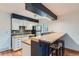 Kitchen with stainless steel appliances, butcher block counters and bar stool seating at 695 Manhattan Dr # 109, Boulder, CO 80303