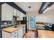 Kitchen with stainless steel appliances, wood countertops and custom backsplash at 695 Manhattan Dr # 109, Boulder, CO 80303