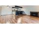 Spacious living room featuring new flooring, bar seating and a fireplace at 695 Manhattan Dr # 109, Boulder, CO 80303