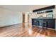 Inviting living space with hardwood floors and a breakfast bar with bar stool seating at 695 Manhattan Dr # 109, Boulder, CO 80303