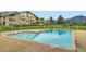 Community pool with a safety fence and view of the mountains at 695 Manhattan Dr # 109, Boulder, CO 80303