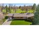 Charming single-story brick home featuring a large driveway and adjacent golf course views for a relaxing backdrop at 16 Wedge Way, Littleton, CO 80123